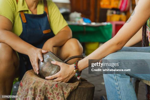 young asian woman enjoying experiential travel. - experiential vacations stock pictures, royalty-free photos & images