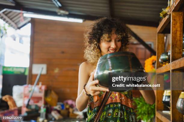 young asian woman enjoying experiential travel. - experiential vacations stock pictures, royalty-free photos & images