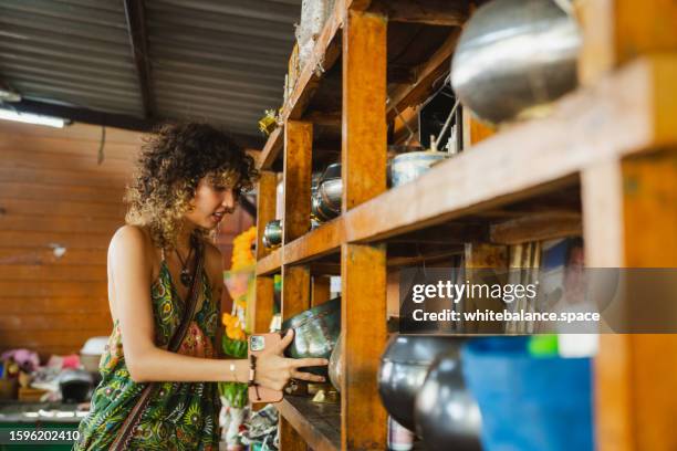 young asian woman enjoying experiential travel. - alms stock pictures, royalty-free photos & images