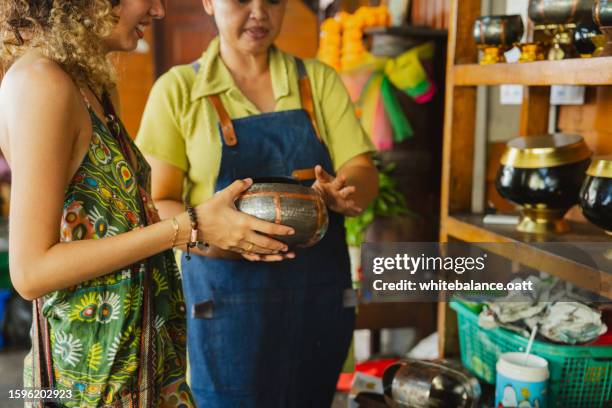 young asian woman enjoying experiential travel. - experiential vacations stock pictures, royalty-free photos & images