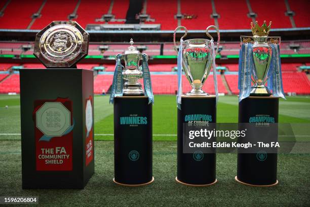 Detailed view of the FA Community Shield, the FA Cup Trophy, UEFA Champions League Trophy and Premier League Trophy prior to The FA Community Shield...