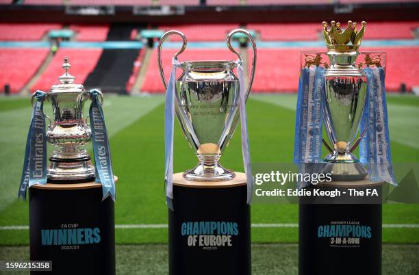 Detailed view of the FA Cup Trophy, UEFA Champions League Trophy and Premier League Trophy prior to The FA Community Shield match between Manchester...