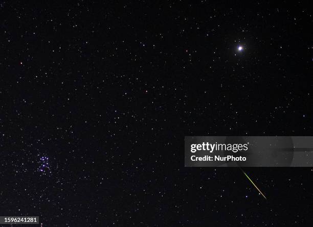 Meteor streaks across the sky during the peak of annual Perseid meteor shower, over an abandoned historic caravanserai, near the city of Garmsar in...