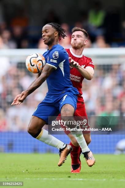 Raheem Sterling of Chelsea and Andrew Robertson of Liverpool during the Premier League match between Chelsea FC and Liverpool FC at Stamford Bridge...