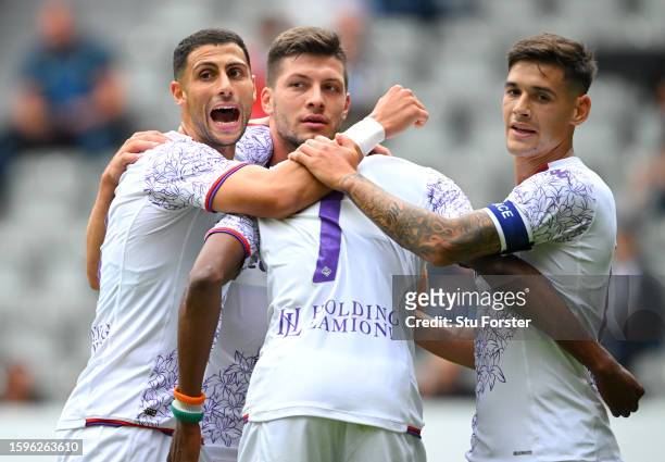 Fiorentina goalscorer Christian Kouame is congratulated by team mates Rolando Mandragora Luka Jovic and Lucas Martinez Quarta after scoring the...
