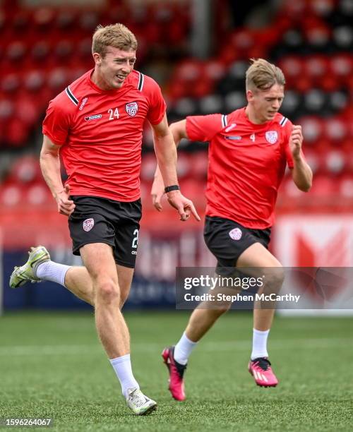 Derry , United Kingdom - 13 August 2023; Injured Derry City players Sam Todd, left, and Ciaron Harkin before the SSE Airtricity Men's Premier...