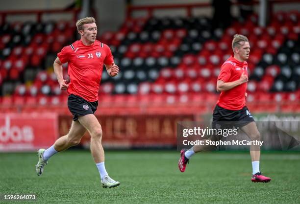 Derry , United Kingdom - 13 August 2023; Injured Derry City players Sam Todd, left, and Ciaron Harkin before the SSE Airtricity Men's Premier...