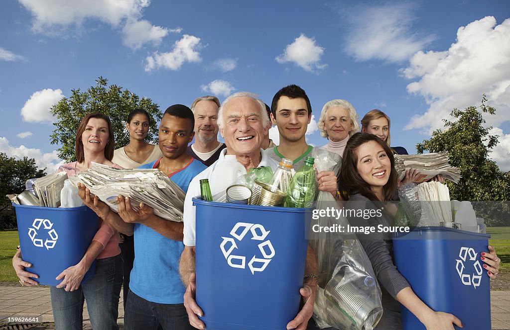Group of people with recycling in bins