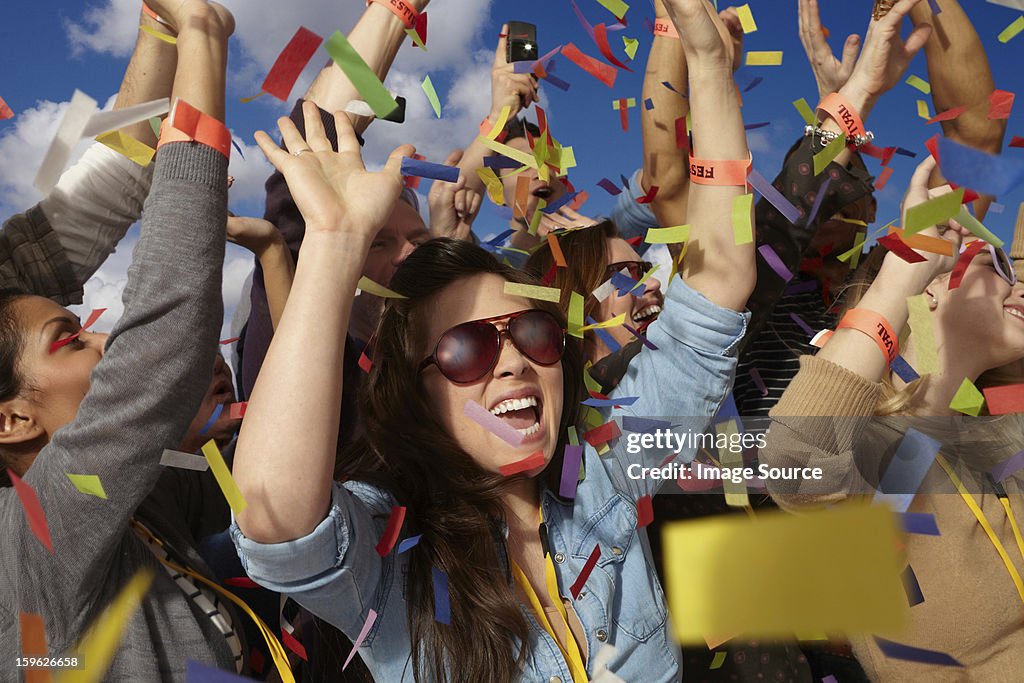 People cheering at a music festival