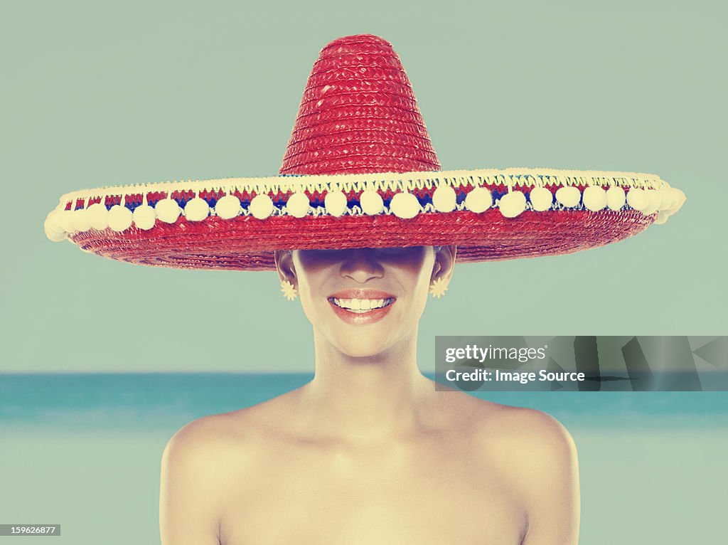Young woman wearing red sombrero