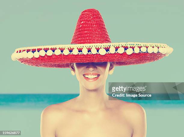 young woman wearing red sombrero - sombrero hat stock pictures, royalty-free photos & images
