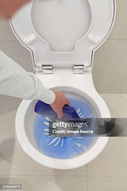 pouring disinfectant into toilet - lixívia imagens e fotografias de stock