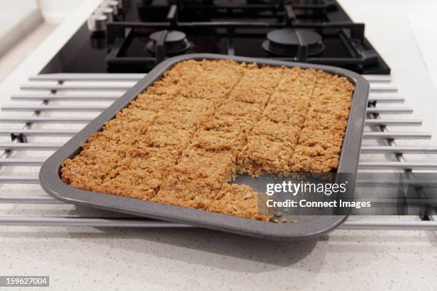 flapjacks in a tray - cake tin stock pictures, royalty-free photos & images
