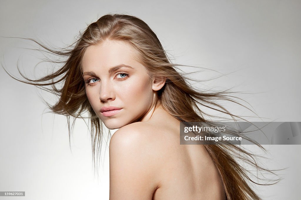 Woman with windswept long hair