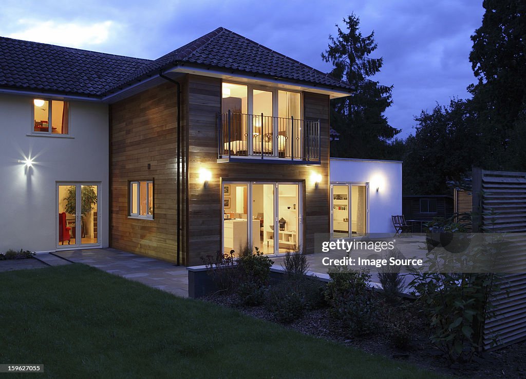 Large house illuminated in the evening