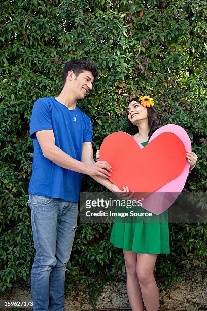 couple holding heart shape - lastra a signa stock pictures, royalty-free photos & images