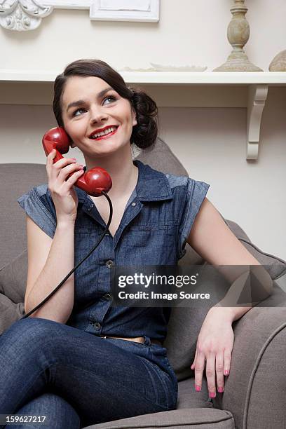 woman on sofa on the phone - lastra a signa stock pictures, royalty-free photos & images