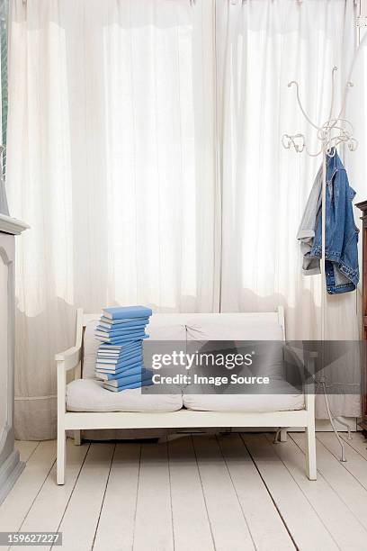 empty seat with pile of blue books - lastra a signa stock pictures, royalty-free photos & images