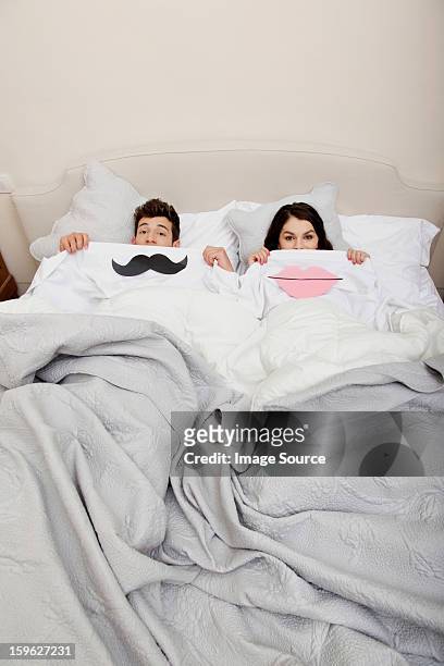 couple in bed with lips and moustache - lastra a signa stock pictures, royalty-free photos & images