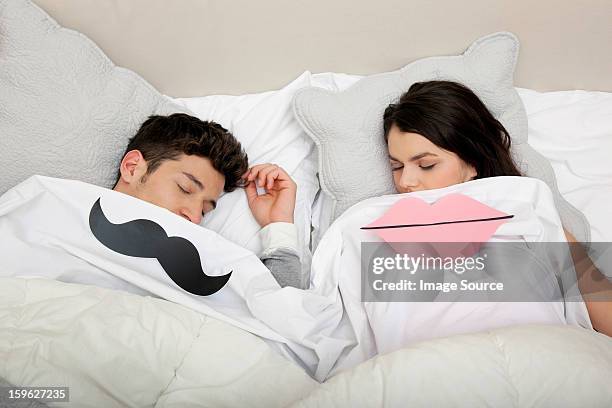 couple in bed with lips and moustache - lastra a signa stock pictures, royalty-free photos & images