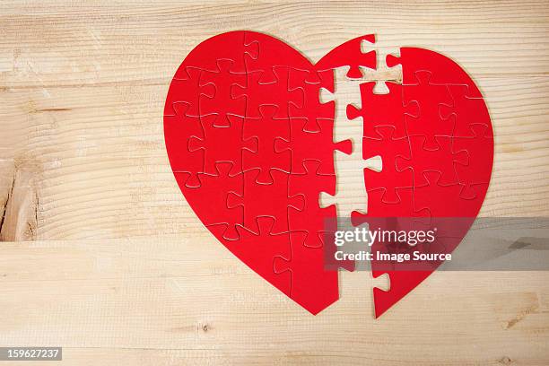 heart shaped jigsaw puzzle - lastra a signa stock pictures, royalty-free photos & images
