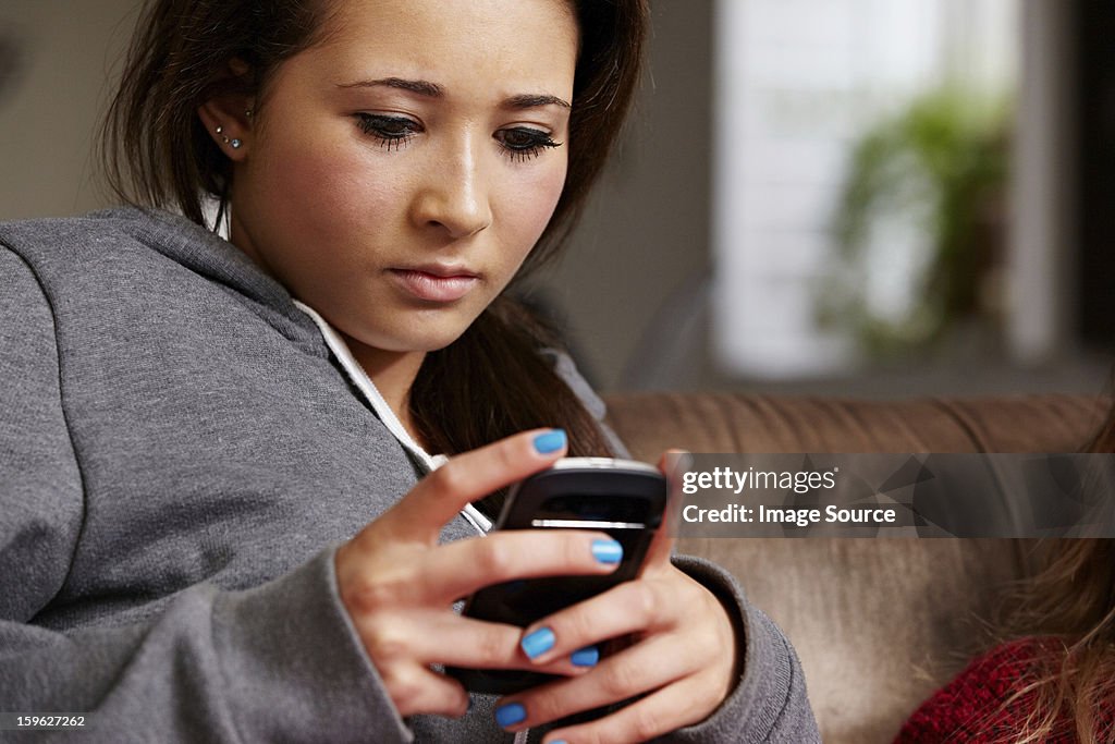 Teenage girl looking at cellphone