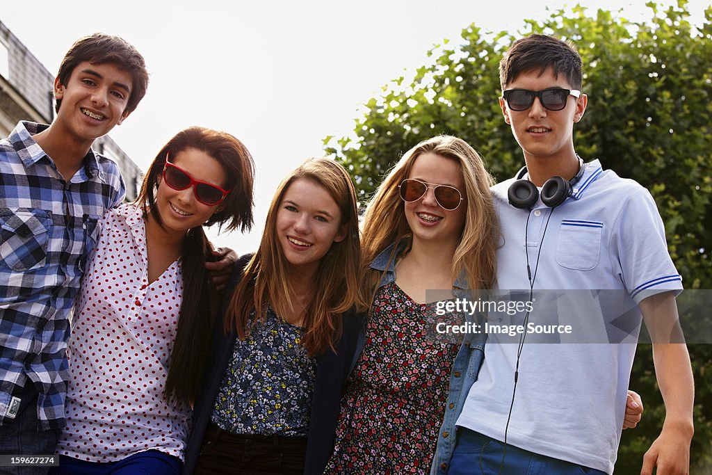 Teenage friends looking at camera