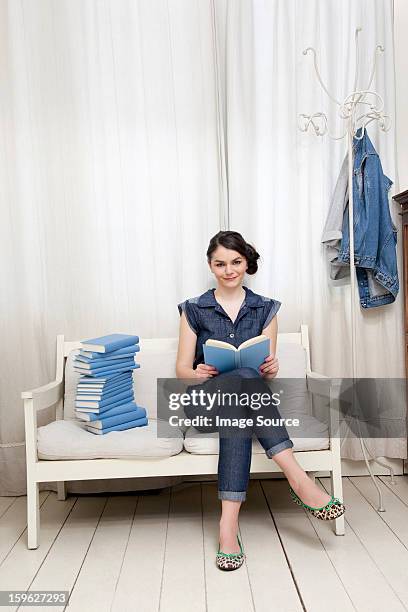 young woman reading book - lastra a signa stock pictures, royalty-free photos & images