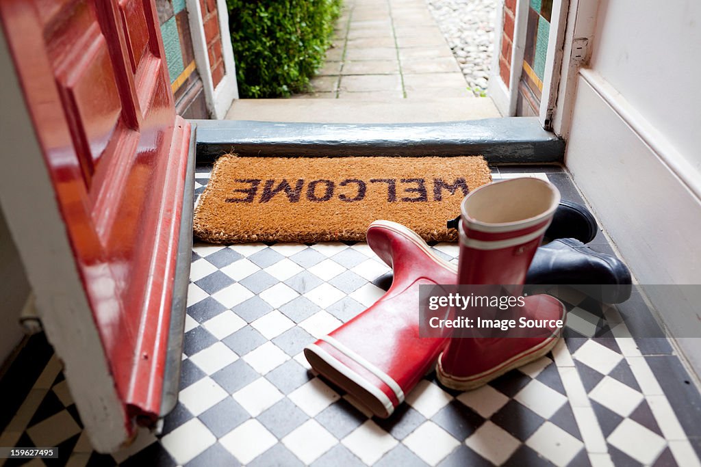 Welcome mat and wellington boots