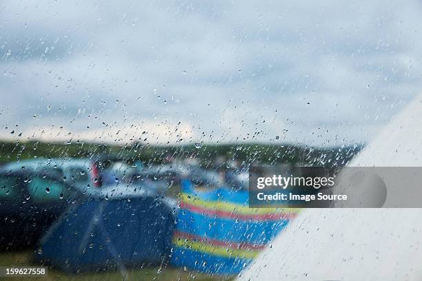 camp site in the rain - cortina rompeviento fotografías e imágenes de stock