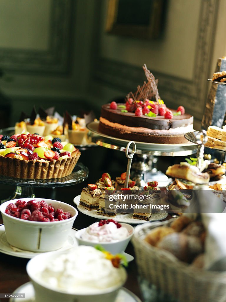 Close up of table with desserts and fruit