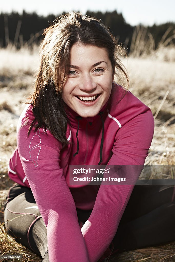 Woman wearing sportswear smiling to camera