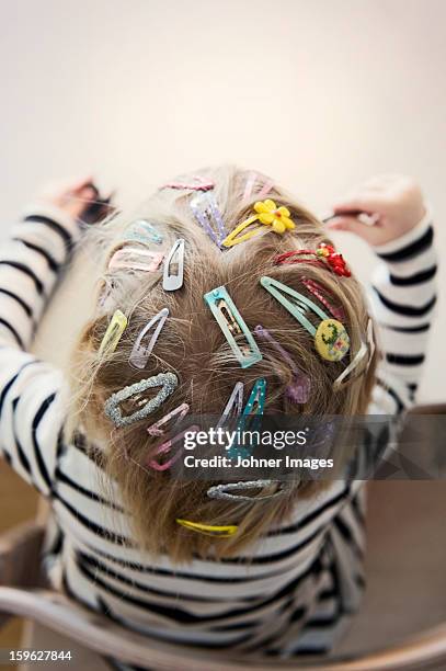 girl with colorful hairpins - haarspange stock-fotos und bilder