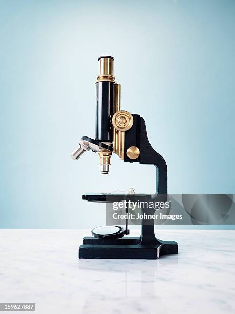 studio shot of microscope - microscoop stockfoto's en -beelden