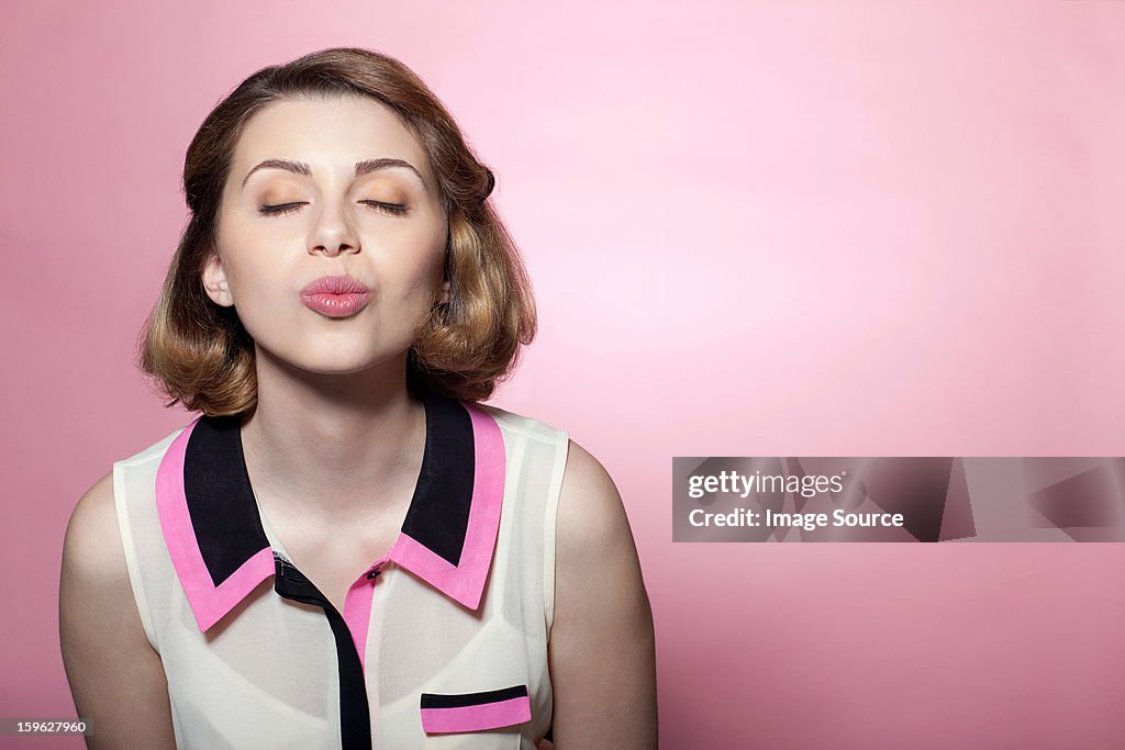 Woman puckering lips
