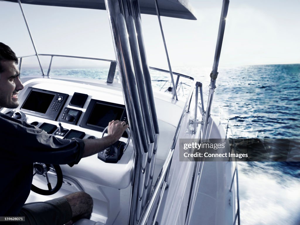 Man driving power boat