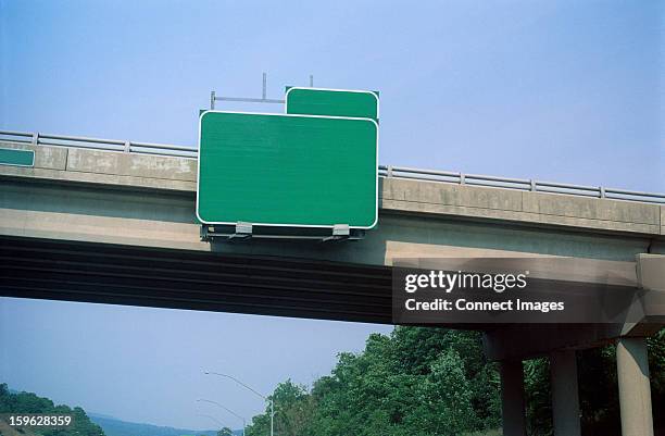 blank exit sign on highway overpass - traffic signs stock pictures, royalty-free photos & images