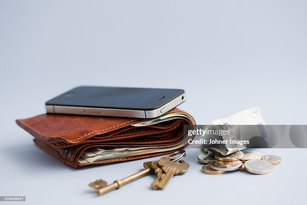 Wallet with cash, phone and keys