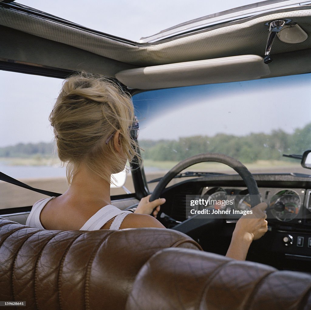 A woman driving a car, Sweden.