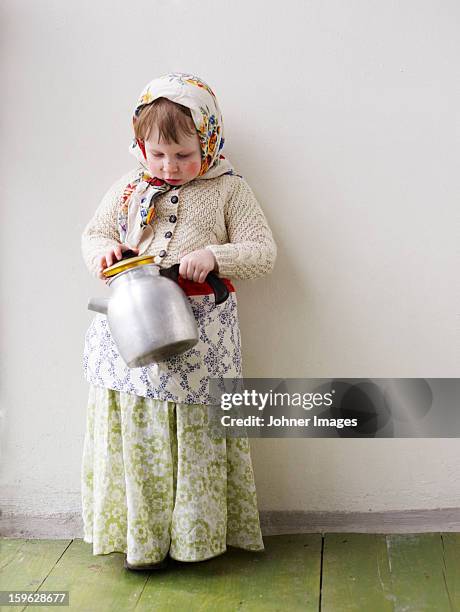a young girl dressed up as an easter witch, sweden. - traditionell klädsel bildbanksfoton och bilder