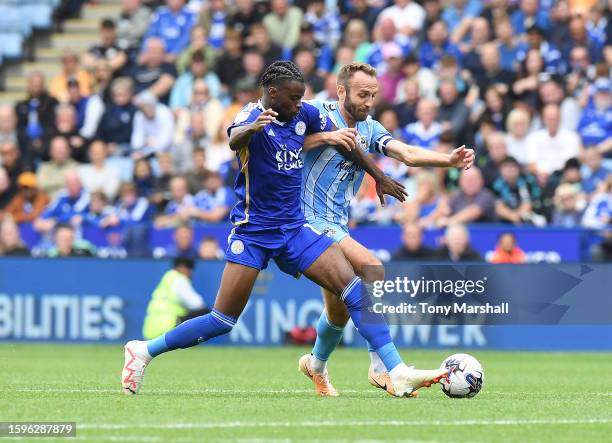 Stephy Mavididi of Leicester City is challenged by Liam Kelly of Coventry City during the Sky Bet Championship match between Leicester City and...