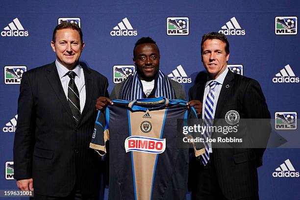 Stephen Okai of the University of Mobile poses for photos with team officials after being selected by the Philadelphia Union as the 31st overall pick...