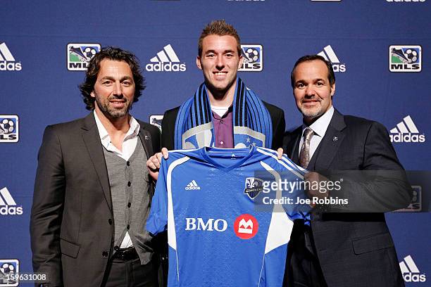 Brad Stuver of Cleveland State poses for photos with team officials after being selected by Montreal Impact as the 32nd overall pick in the 2013 MLS...