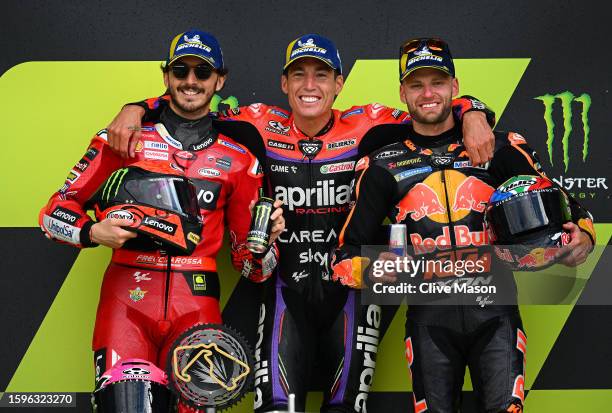 Francesco Bagnaia of Italy, second placed rider, Aleix Espargaro of Spain, race winner and Brad Binder of South Africa, third placed rider celebrate...