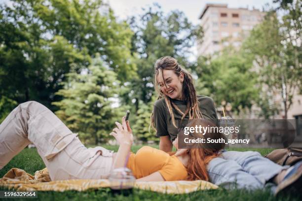 women in park - south park stock pictures, royalty-free photos & images