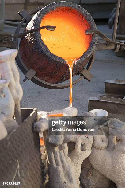 Pouring of molten bronze metal into molds at the casting of the Screen Actors Guild Award statuettes, at the American Fine Arts Foundry on January...