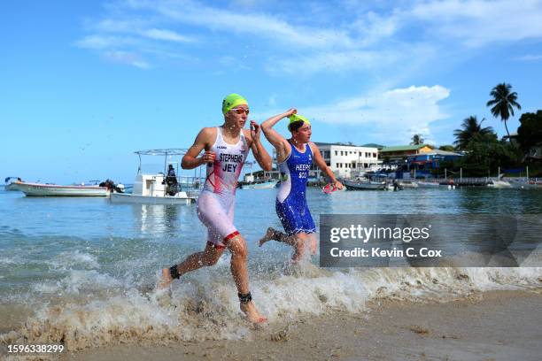 Siena Stephens of Team Jersey and Jessica Heeps of Scotland leave the water as they compete in the Triathlon on day two of the 2023 Youth...