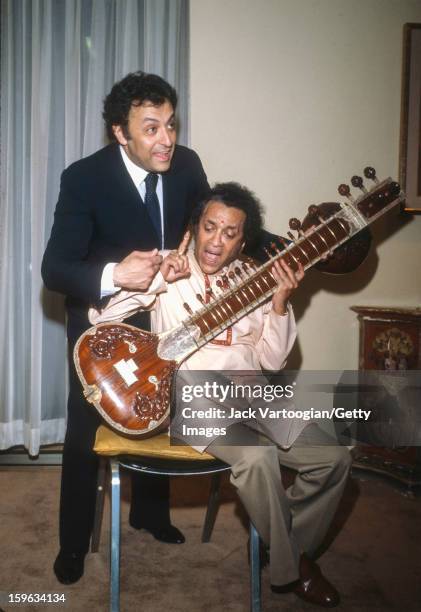 Following the first performance of his 'Concerto No. 2 for Sitar and Orchestra' , Indian musician Ravi Shankar poses with conductor Zubin Mehta of...