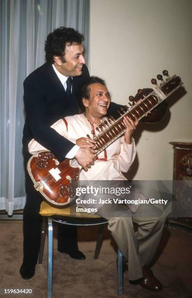 Following the first performance of his 'Concerto No. 2 for Sitar and Orchestra' , Indian musician Ravi Shankar poses with conductor Zubin Mehta of...