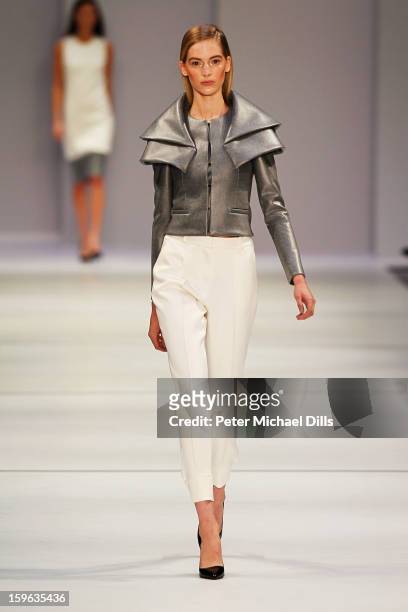 Model walks the runway at Hugo By Hugo Boss Autumn/Winter 2013/14 fashion show during Mercedes-Benz Fashion Week Berlin at Opernwerkstatte on January...